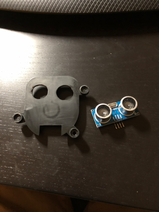 Ultra sonic range finder and coin return plate